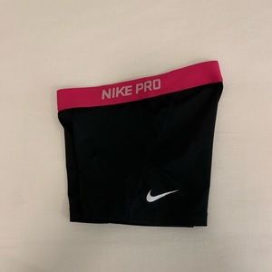 Black Nike pros with pink band
